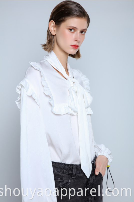 Flowing blouse with high neck and bow